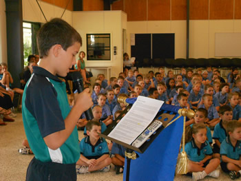 Student talking at assembly
